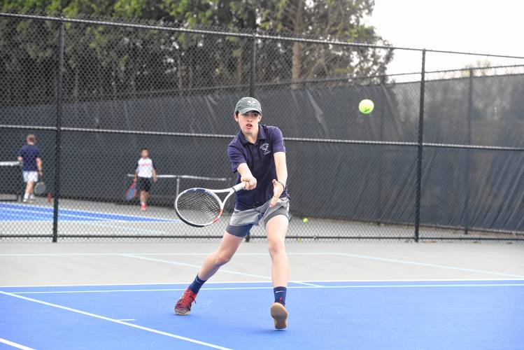 Frontier’s Caiden Manning returns a serve in No. 3 singles against Pope Francis on Monday in South Deerfield. 