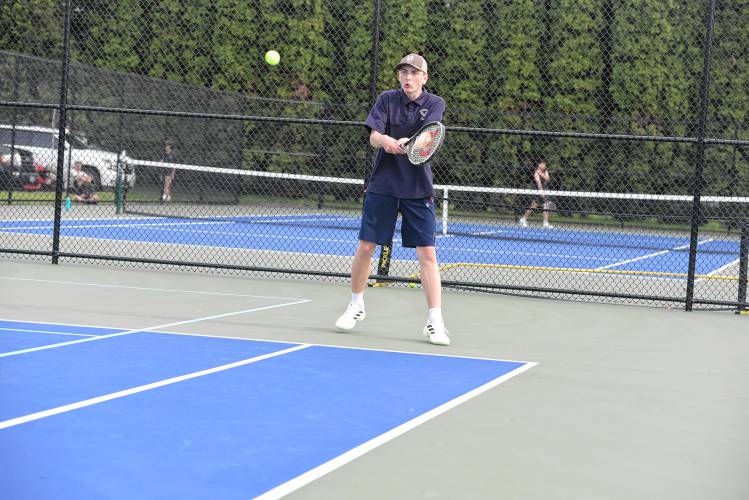 Frontier’s Oliver Brown returns a volley during a No. 1 doubles match against Pope Francis on Monday in South Deerfield. 