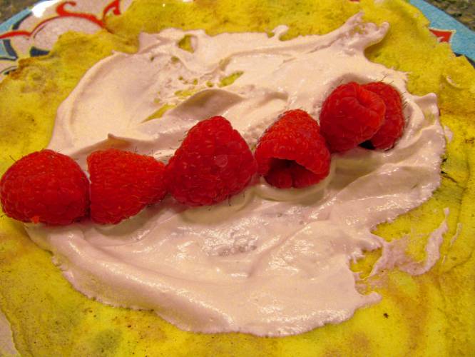 For sweet crêpes, a dab of whipped cream and a few raspberries, added after cooking but before rolling or folding, make a nice addition.