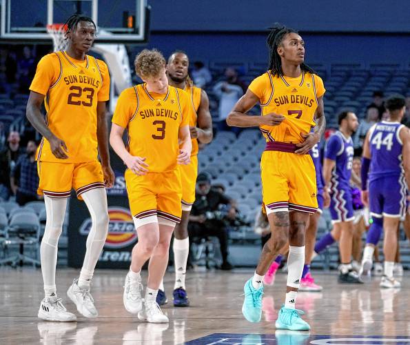 Arizona State's Akil Watson (23), Brycen Long (3), Malachi Davis (7), Braelon Green (2) and others walk off the court after a game against TCU last season. Watson announced Wednesday he was transferring to UMass.