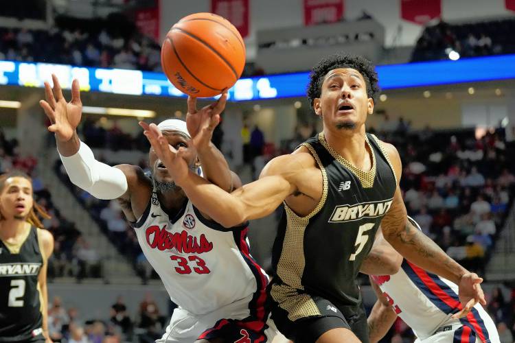 Mississippi forward Moussa Cisse (33) and Bryant forward Daniel Rivera (5) reach for a rebound last season in Oxford, Miss. Rivera announced on Tuesday he was transferring to UMass.