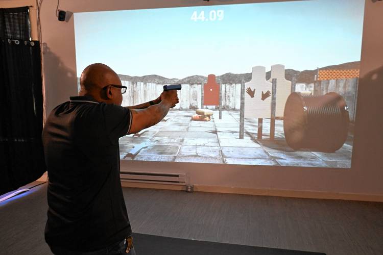 Leon “Lee” Laster of the Western Massachusetts Training & Education Academy runs through a simulator at his Millers Falls business.