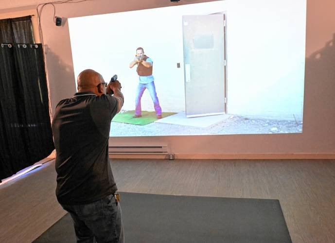 Leon “Lee” Laster of the Western Massachusetts Training & Education Academy runs through a simulator at his Millers Falls business.