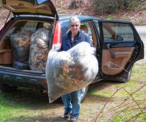 Barbara Goodchild of Barberic Farm in Shelburne unloads bags of waste wool she is donating to Western Mass Fibershed to make into wool pellets. “I think it is a great project, otherwise the wool literally gets thrown away in the woods,” Goodchild said.