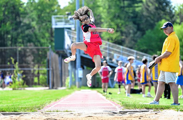 Athol’s Emmett Flynn flies through the air in the long jump during a meet against Mohawk Trail   in Buckland on Tuesday. 