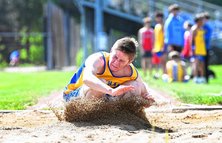 Mohawk Trail’s Qwade Niquette lands the long jump during a meet against Athol in Buckland on Tuesday. 