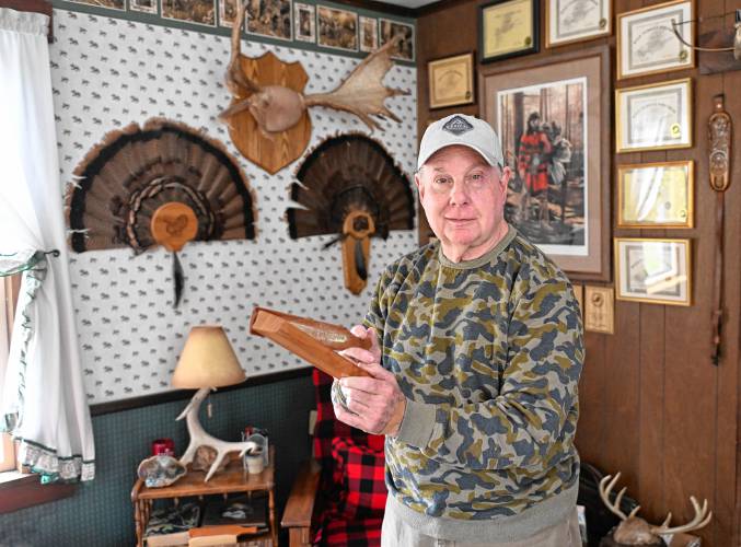 Joe Judd with a wild turkey box call in his Shelburne home.