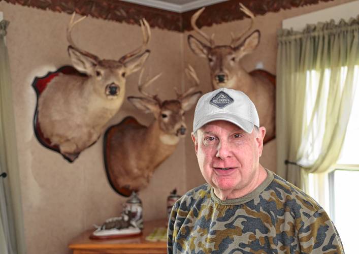 Joe Judd with deer mounts of bucks he took with bow and arrow.