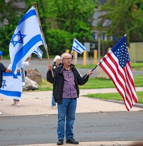 Moshe Ronen counter protests at a rally protesting the destruction of health care in Gaza in front of Baystate Medical Center in Springfield on Tuesday morning. 