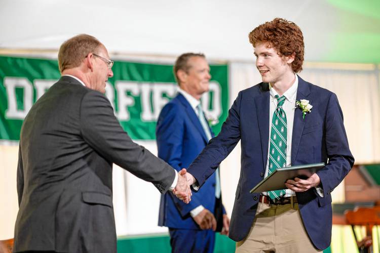 Head of School John Austin (left) and graduate Rufus Mahoney of Greenfield during Deerfield Academy’s commencement ceremony on Sunday morning.