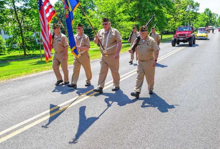 Honor guard members from the Hale-Clapp Veterans of Foreign Wars Post 3295 march during the Whately Memorial Day parade on Sunday.