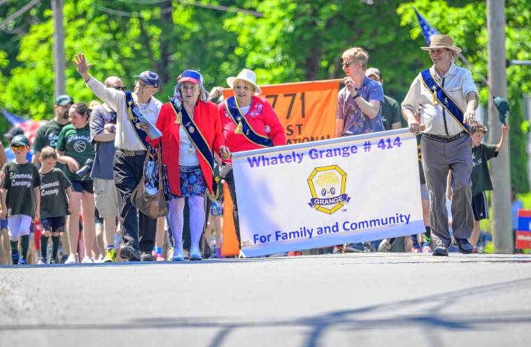 Members of the Whately Grange, the Whately Congregational Church and the Whately Recreation Commission march during the Whately Memorial Day parade on Sunday.