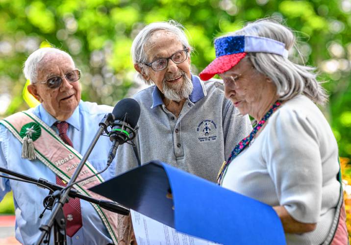 Whately resident and World War II veteran Walter Harubin, 103, center, is presented the National Grange’s Patriots Award by Grange members James Martin, left, of Chesterfield and Ruth Leahey, of Whately, during the Whately Memorial Day parade on Sunday.