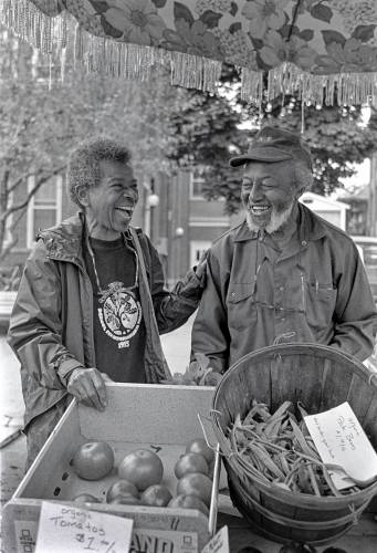 Juanita and Wally Nelson learned about farmers markets in the early 1970s while making their first attempts at farming during a brief stint in New Mexico; after moving to Deerfield in 1974, they mentioned the concept to area farmers and helped get the Greenfield Farmers Market going.