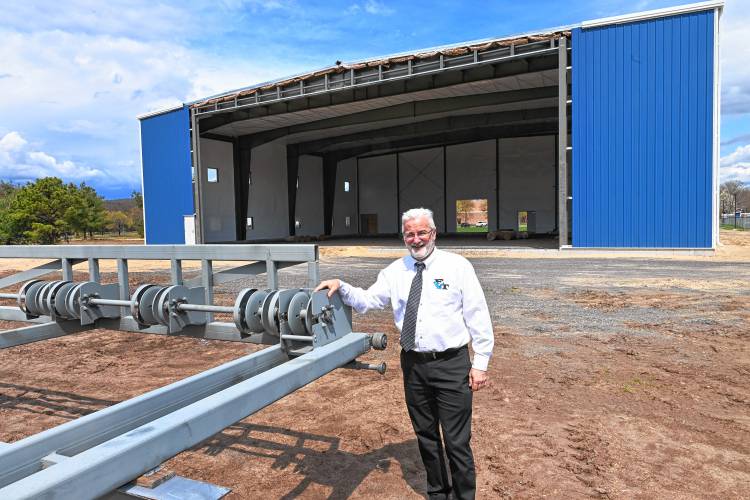 Franklin County Technical School Superintendent Rick Martin outside the 12,000-square-foot aviation building being built at the Turners Falls Airport next to the Franklin County Technical School.