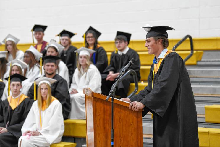 Pioneer Valley Regional School Class President Hugh Cyhowski introduces teacher Kathleen Malsch who gave the commencement address on Friday night.