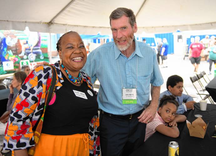 John Waite, executive director of the Franklin County Community Development Corporation, right, with Diane Johnson at the organization’s 45th anniversary block party in Greenfield on Thursday.