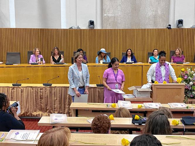 CONTRIBUTED PHOTO/JAMES BARTLETT Pamela Adams, left, of Greenfield, receives a 2024 Commonwealth Heroine award for her service to immigrants and refugees in Greenfield.