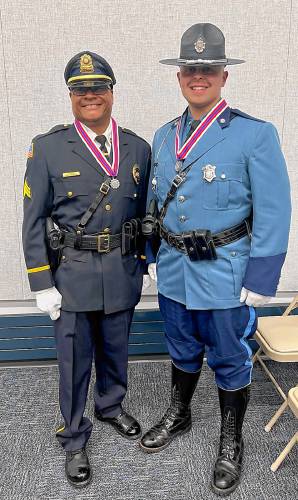 From left, retired Montague Police Sgt. Lee Laster and Massachusetts State Trooper Hunter Ratelle at the Massachusetts State Police headquarters on June 5, where both men were awarded Medals of Valor for their actions during a 2022 house fire in Millers Falls.