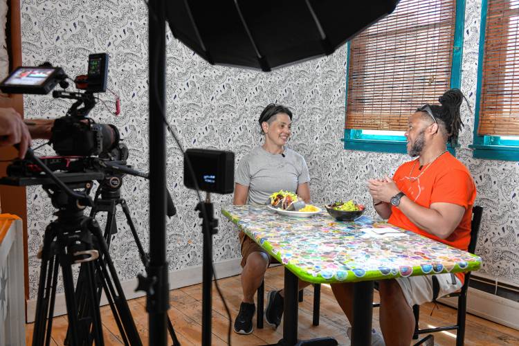 Mesa Verde owner Amy McMahan is interviewed by Theo Williams of America’s Best Restaurants in the Greenfield restaurant on Tuesday.