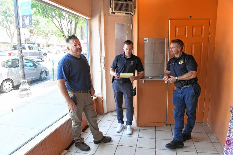 Sgt. Todd Clark, Sgt. Jay Butynski and acting Chief Todd Dodge of the Greenfield Police Department inside 205 Main St., where they plan to open a substation for police to have a downtown presence.