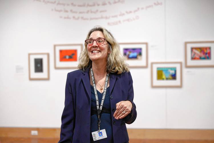 Jennifer Schantz, executive director of the Eric Carle Museum, welcomes visitors to a tour of “Fuzuê! Invention & Imagination in the Art of Roger Mello,” the new exhibit at the at the Carle.