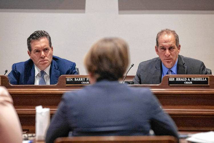 Sen. Barry Finegold and Rep. Jerald Parisella, co-chairs of the Joint Committee on Economic Development, listen to testimony from Gov. Maura Healey on May 7.