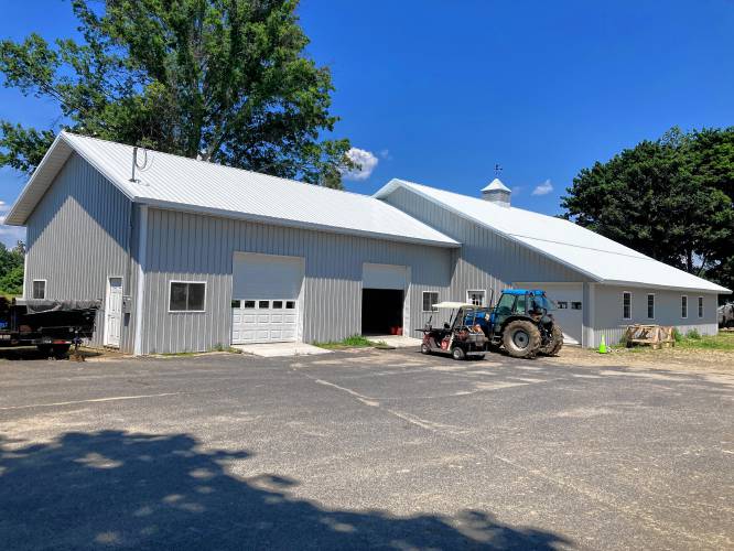 A new barn has already been built to replace some of the structures lost to the lightning strike fire of June 2023.