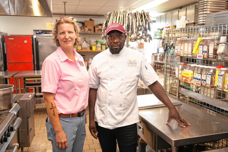 Pam Adams, executive pastry chef and director of bakery operations at the University of Massachusetts Amherst, has been using her experience growing up in Haiti to help employ Haitian immigrants like Samuel Noel, who now works in a UMass kitchen.