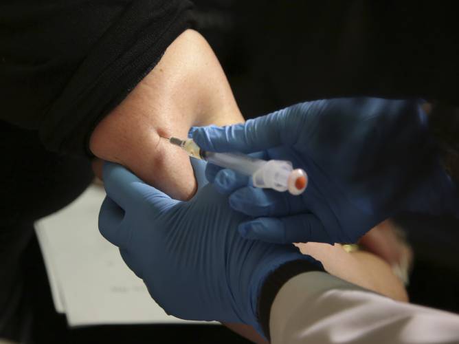 In this March 27, 2019, file photo, a woman receives a measles, mumps and rubella (MMR) vaccine at the Rockland County Health Department in Pomona, New York. With the state Department of Public Health having reported an adult case of measles in Worcester County earlier this month following international travel, public health officials are advising there are measures people can take to reduce their likelihood of contracting the highly contagious disease.