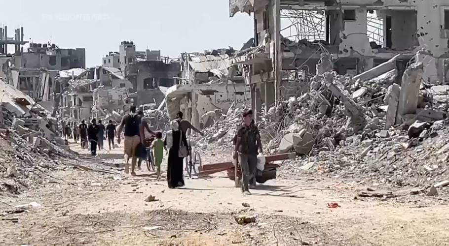 In this image taken from video, Palestinians return to the destruction in Gaza City’s Shijaiyah neighborhood on July 11, after Israeli troops withdrew after an offensive.