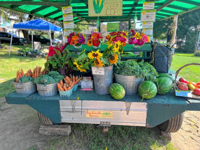 J & J Farms’ road-side stand loaded with summer produce and flowers. Cut flowers may be a bigger part of J & J Farms’ business now that they’re no longer milking cows.