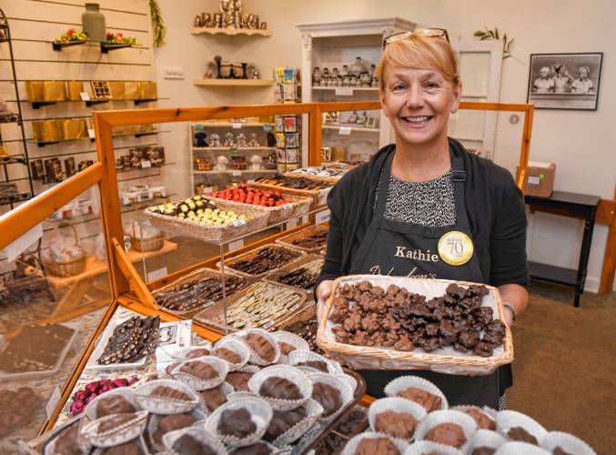 Kathie Williams of Richardson’s Candy Kitchen in Deerfield with some of their Dixies made with caramel, nuts and chocolate.