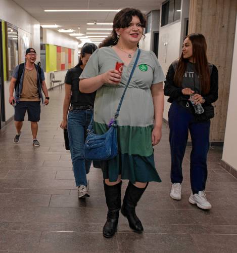 Shelly Bowder, 19, a Holyoke Community College student, walks through campus looking at the community boards as part of her internship with the Student Ambassador Mentoring Program, after talking about how a new initiative to make community college free will impact her life. 