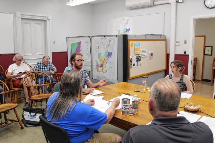 At-Large City Councilor John Garrett discusses a package of proposed zoning amendments intended to ramp up housing development with the Greenfield Planning Board on Thursday.