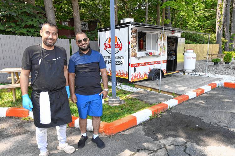 Fagi Agory and owner Mohammad Obeidat at the Habeeby Falafel and Shawarma truck located at the Mobil gas station near the rotary in Greenfield. Obeidat also owns the gas station and convenience store.