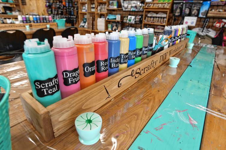 A rainbow of paint colors at Scrafty DIY Workshop in Orange. 