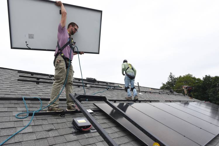 PV Squared workers install a solar array on the Greenfield Department of Public Works building on Wells Street in 2023. The solar company has been named the 2024 winner of the Most Forward-Thinking Contractor Award.