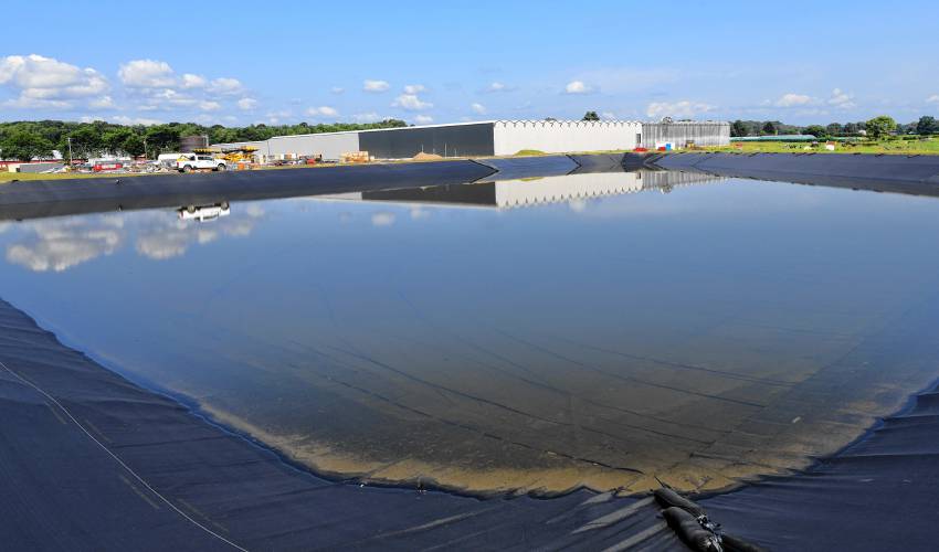 A 4.5-million-gallon retaining pond will store water captured by the roofing system of the new labs/greenhouses being built across the road from Nourse Farms’ headquarters in Whately. 