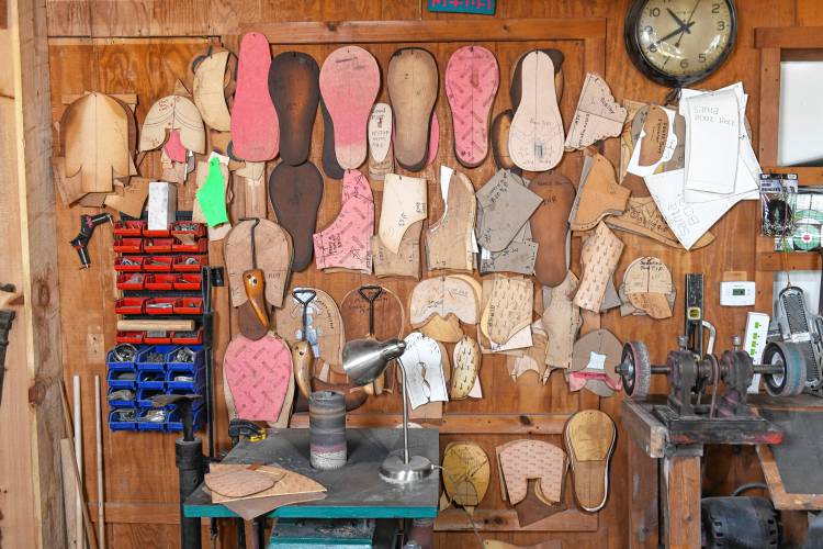 Patterns and templates line the walls of Jolly Walkers Clown Shoes in Wendell.