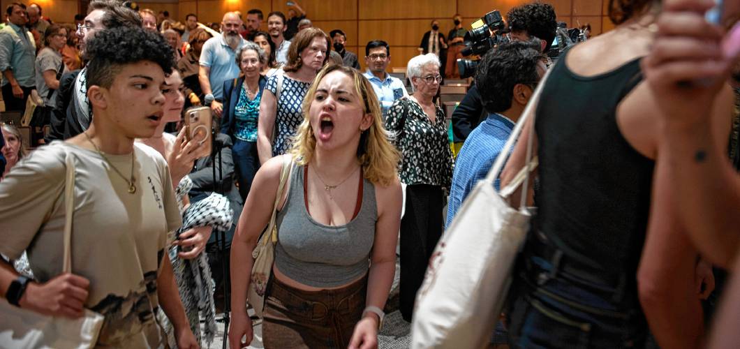 University of Massachusetts Amherst students chant and yell as they leave the Mahar Auditorium after a Faculty Senate meeting on May 14 where Chancellor Javier Reyes defended the crackdown on student protesters on May 7, when 134 people were arrested.