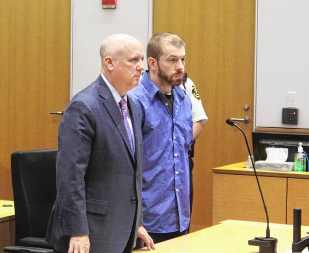 Branden M. Eugenio, 31, stands next to his defense attorney, Daniel Kelly, in Franklin County Superior Court on Thursday. Eugenio faces 29 charges, including rape and suffocation.