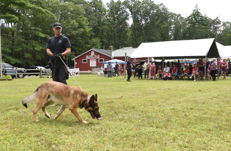 Massachusetts State Trooper Nick Pickunka has Cezar do an article search during a working dog demonstration at the 2023 “Mutts in Need” fundraiser at the Millers Falls Rod & Gun Club. The event returns Saturday.