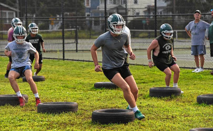 Jon Breor, center, and the Greenfield football team opened preseason camp on Friday in preparation of their 2024 season opener on Sept. 13 against Chicopee.