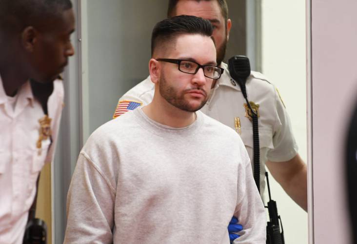 Ryan O’Farrell is led into Franklin County Superior Court on Monday.