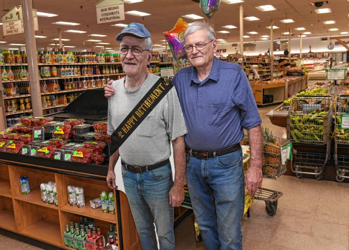 Gary Stevens, who is retiring from Foster’s Supermarket in Greenfield, hangs out with a cardboard cut-out of himself honoring him for his 50 years of employment.