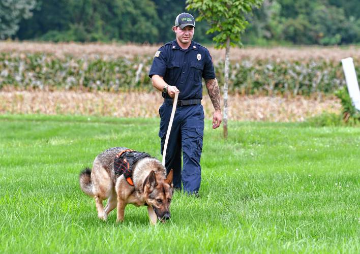 Matt Manheim of the Sunderland Fire Department works his search-and-rescue German shepherd named Ranger behind the Sunderland Public Safety Complex.