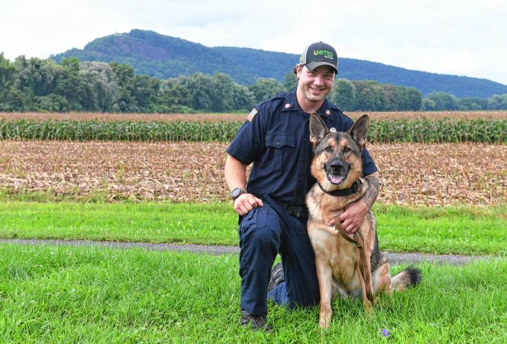 Matt Manheim of the Sunderland Fire Department with his search-and-rescue German shepherd named Ranger.