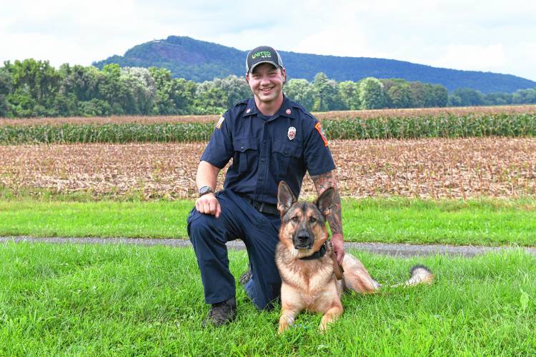 Matt Manheim of the Sunderland Fire Department with his search-and-rescue German shepherd named Ranger.