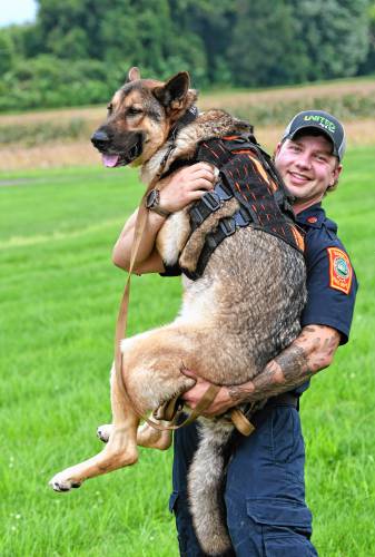 Matt Manheim of the Sunderland Fire Department with his search-and-rescue German shepherd named Ranger.